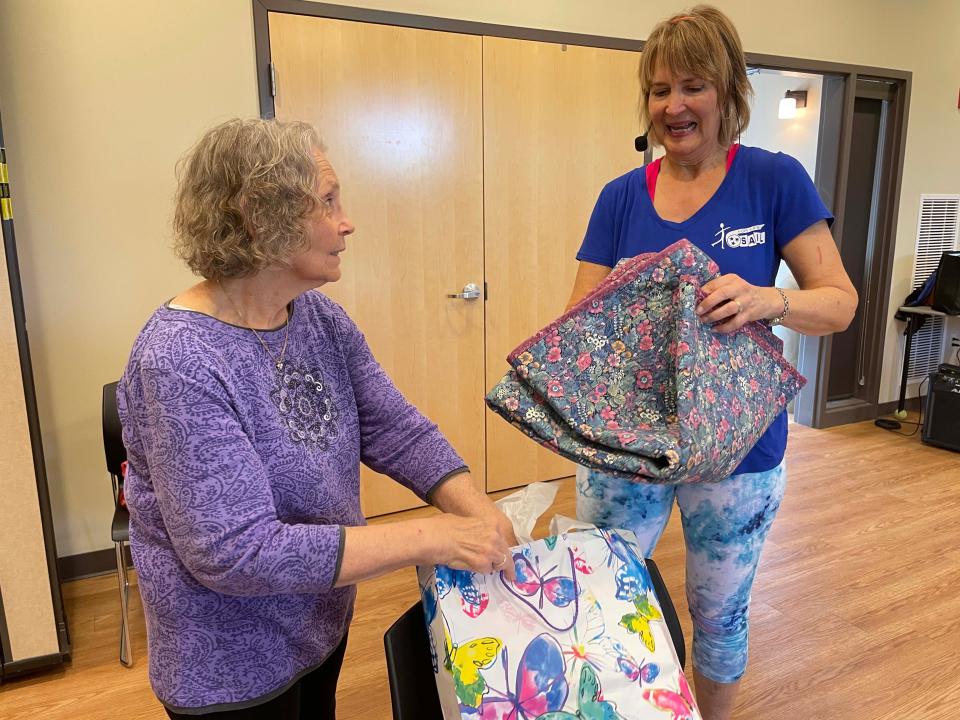 Chris Calhoun made a scripture quilt for Debbie Harris’s retirement party at Karns Senior Center Wednesday, May 4, 2022.