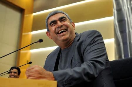 Infosys Chief Executive Vishal Sikka laughs during the announcement of the company's quarter results at its headquarters in Bengaluru, India, April 15, 2016. REUTERS/Abhishek N. Chinnappa