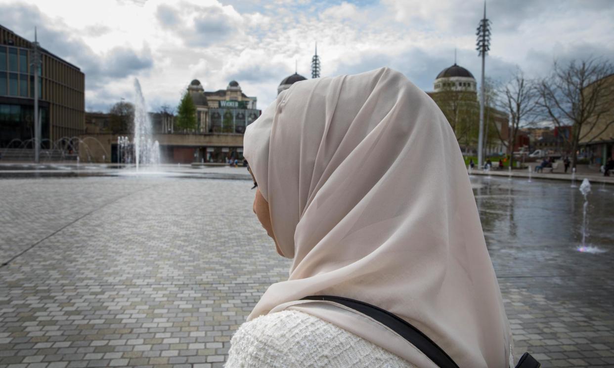 <span>A woman walks through the centre of Bradford almost a week after the fatal stabbing of Kulsuma Akter.</span><span>Photograph: Gary Calton/The Observer</span>