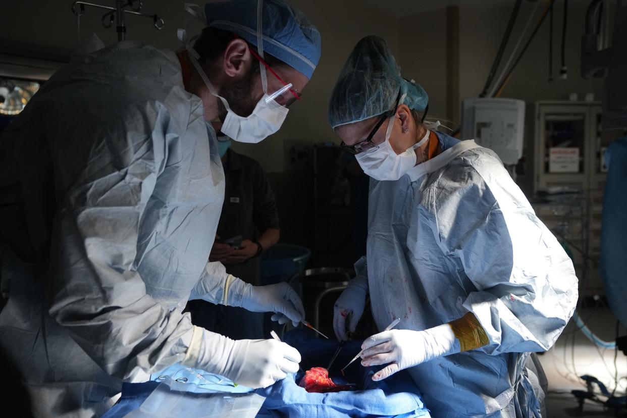 Transplant surgeon Dr. Joel Adler and Dr. Nicole Turgeon, director of the Abdominal Transplant Center at Dell Seton Medical Center, prepare a donated kidney for transport at Dell Seton Medical Center in March. Austin's growing population and the arrival of Dell Medical School has helped rapidly expand medical programs in Central Texas, including transplant programs.