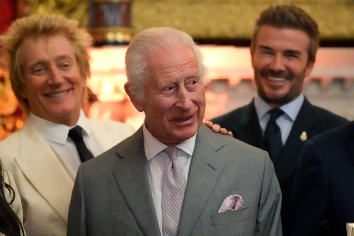 King Charles III at the inaugural King’s Foundation charity awards at St James’s Palace in London with British pop icon Rod Stewart, left, and former footballer David Beckham (AP)