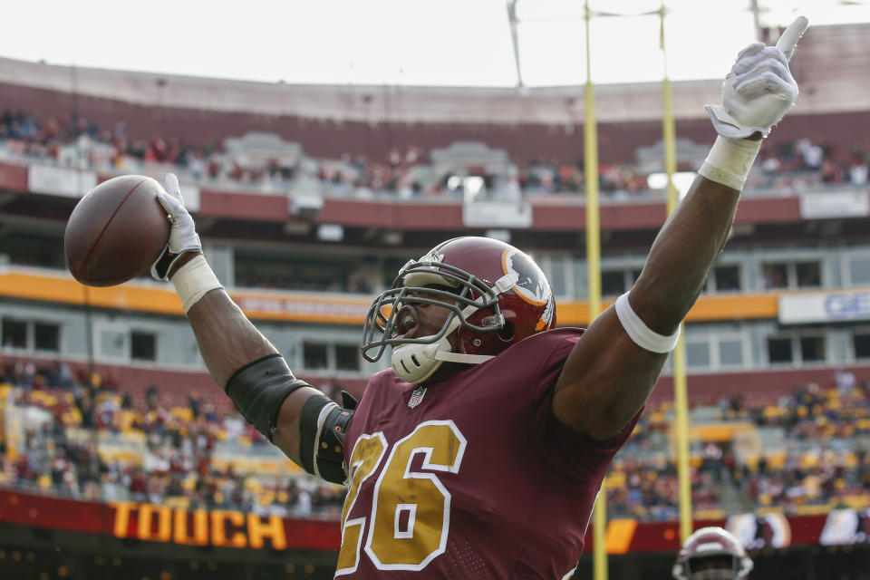 Washington Redskins running back Adrian Peterson (26) celebrates his touchdown during the first half of an NFL football game against the Houston Texans, Sunday, Nov. 18, 2018, in Landover, Md. (AP Photo/Alex Brandon)