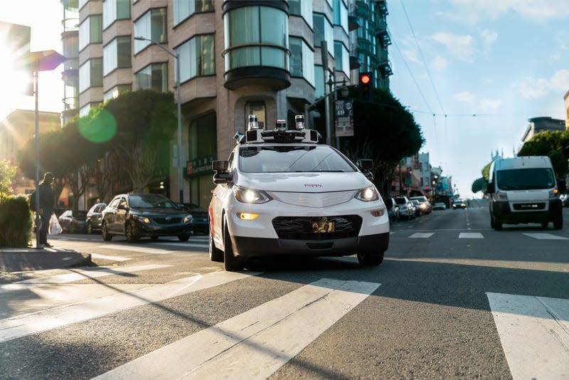 A Cruise-modified Chevy Bolt driving in traffic