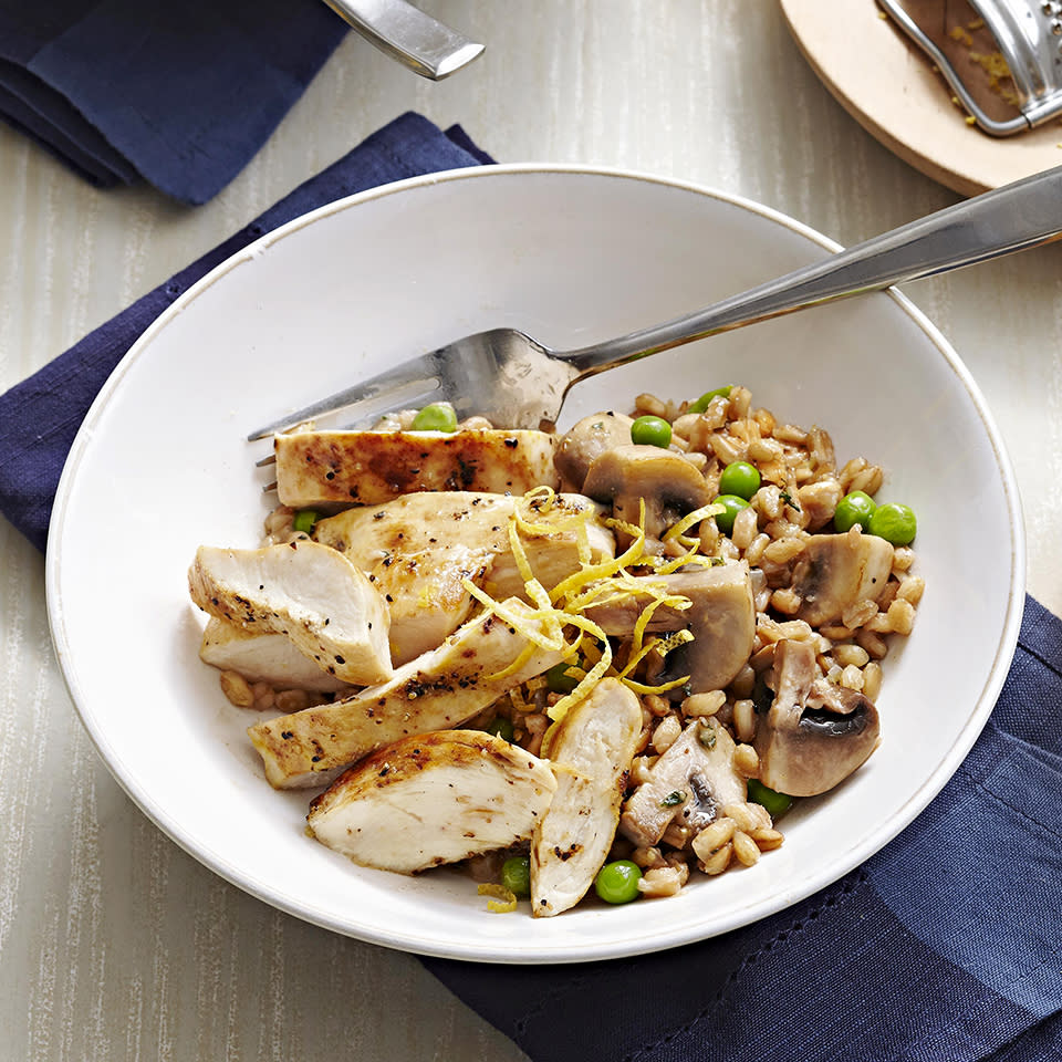 <p>Farro is chewier than Italian rice and adds an earthy flavor to the lemon-pepper chicken and spring peas in this tasty risotto recipe.</p>