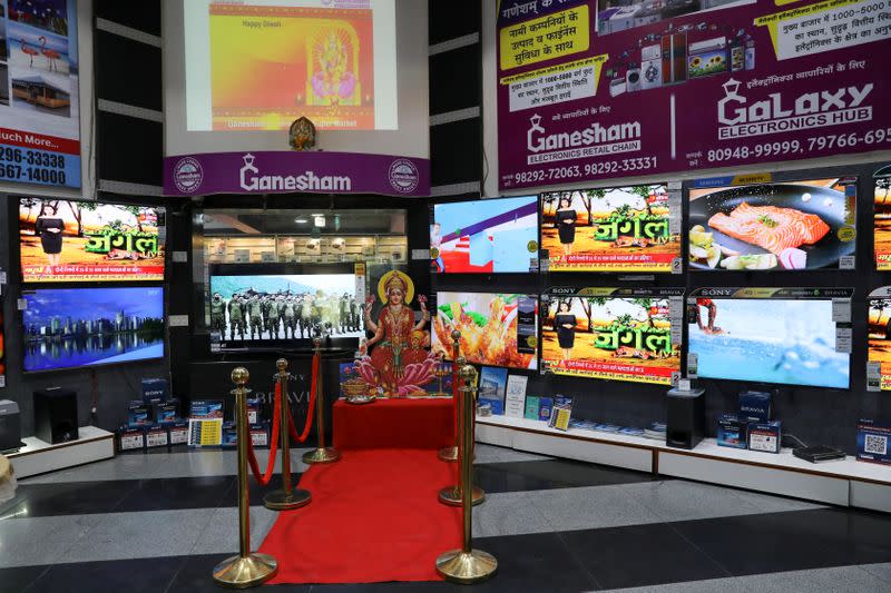 A cutout of the Hindu goddess of wealth and prosperity Lakshmi is seen at an entrance of an electronics and appliances shop in Jaipur