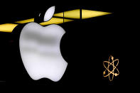 FILE - The Apple logo is illuminated at a store in Munich, Germany, Nov. 13, 2023. The dependence — and extreme vulnerability — starts with the interconnections that bind our computers, phones and other devices. (AP Photo/Matthias Schrader, File)