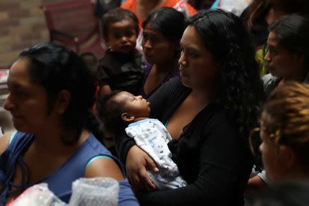 Undocumented immigrant families are released from detention at a bus depot in McAllen, Texas, U.S., June 22, 2018. REUTERS/Loren Elliott