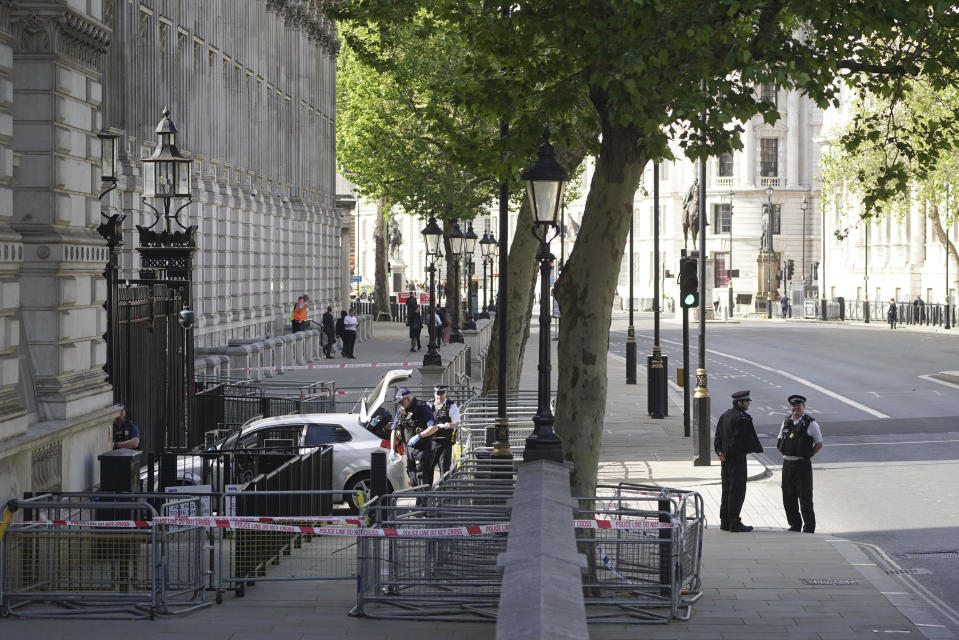 Police at the scene after a car collided with the gates of Downing Street in London, Thursday May 25, 2023. Police say a car has collided with the gates of Downing Street in central London, where the British prime minister’s home and offices are located. The Metropolitan Police force says there are no reports of injuries. Police said a man was arrested at the scene on suspicion of criminal damage and dangerous driving. It was not immediately clear whether the crash was deliberate. (James Manning/PA via AP)