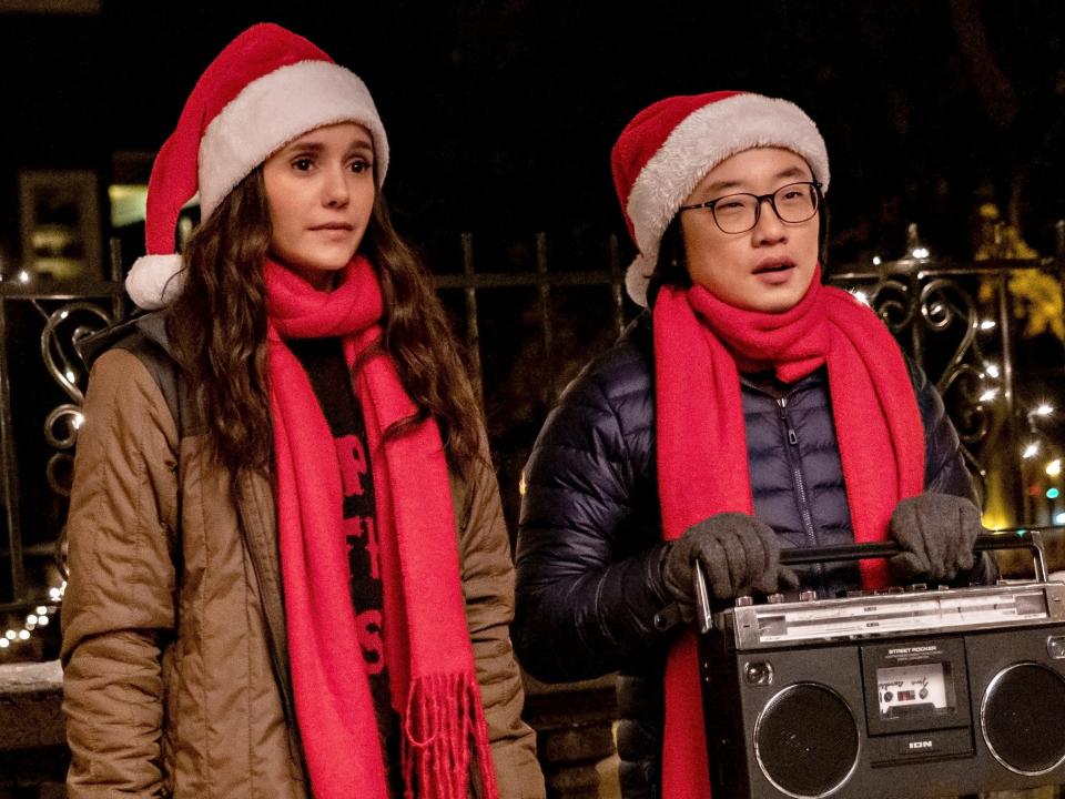 natalie and josh standing with a boombox in love hard