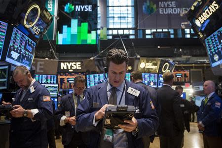 Traders work on the floor of the New York Stock Exchange March 17, 2014. REUTERS/Brendan McDermid