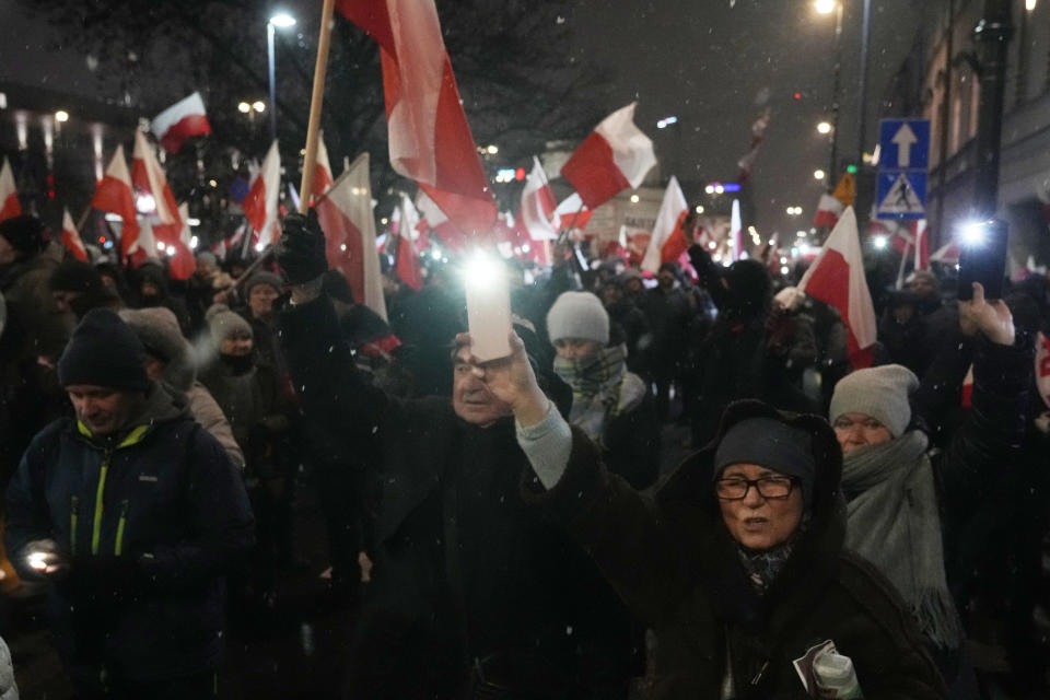 Supporters of right-wing Law and Justice party that lost power in the October parliamentary elections protest the moves by the new pro-European Union government which has taken control of state media, in front of the parliament building in Warsaw, Poland, on Thursday, Jan 11, 2024. Law and Justice, frustrated over the loss of power is seeking to undermine the actions of the new government of Prime Minister Donald Tusk. (AP Photo/Czarek Sokolowski)