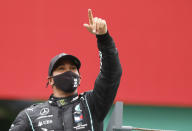 Mercedes driver Lewis Hamilton of Britain celebrates after winning the Formula One Portuguese Grand Prix at the Algarve International Circuit in Portimao, Portugal, Sunday, Oct. 25, 2020. (Rafael Marchante, Pool via AP)