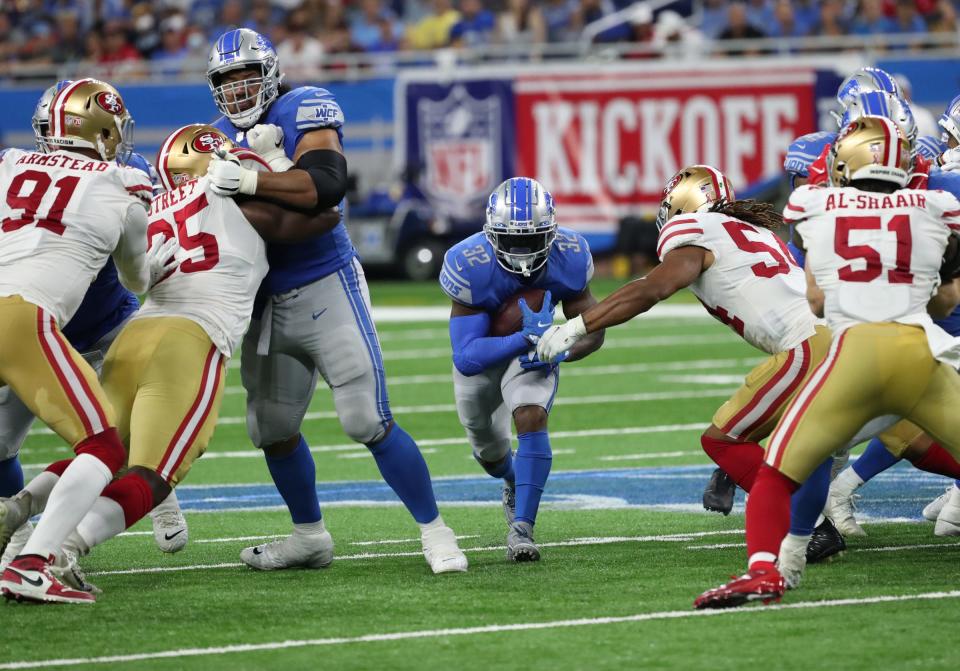 Detroit Lions running back D'Andre Swift (32) runs the ball against the San Francisco 49ers Sunday, Sept. 12, 2021 at Ford Field.