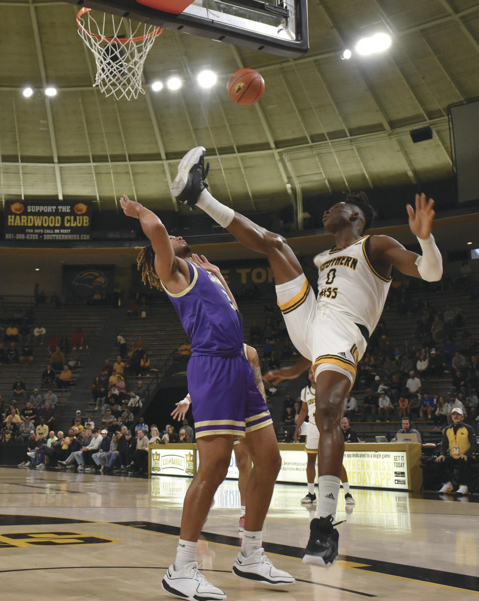 Southern Mississippi forward Victor Iwuakor (0) attempts a rebound over James Madison forward T.J. Bickerstaff (3) during the first half of an NCAA college basketball game Saturday, Jan. 6, 2024, in Hattiesburg, Miss. (Aimee Cronan/The Gazebo Gazette via AP)