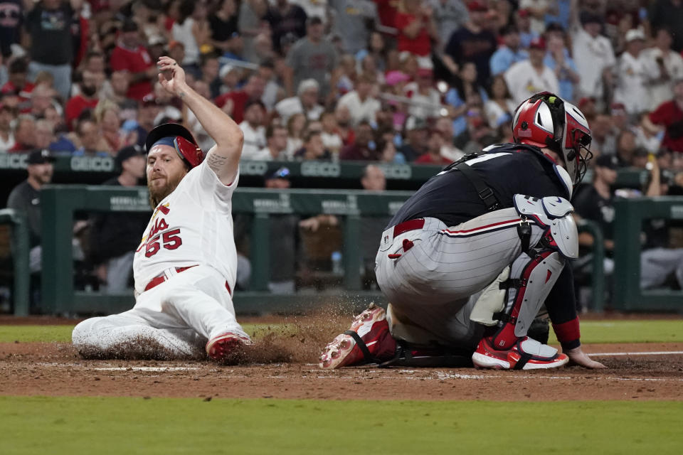 St. Louis Cardinals' Taylor Motter, left, scores past Minnesota Twins catcher Ryan Jeffers during the sixth inning of a baseball game Tuesday, Aug. 1, 2023, in St. Louis. (AP Photo/Jeff Roberson)