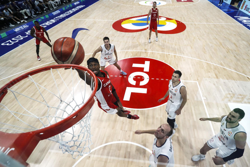 MANILA, PHILIPPINES – SEPTEMBER 08: Shai Gilgeous-Alexander #2 of Canada drives to the basket against Dejan Davidovac #27 of Serbia in the second half during the FIBA Basketball World Cup semifinal game at Mall of Asia Arena on September 08, 2023 in Manila, Philippines. (Photo by Yong Teck Lim/Getty Images)