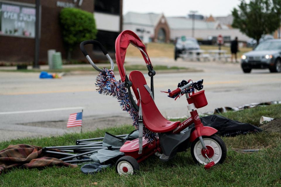 A tricycle is seen near the scene of a mass shooting at a Fourth of July parade route, in the Chicago suburb of Highland Park, Illinois, July 4, 2022