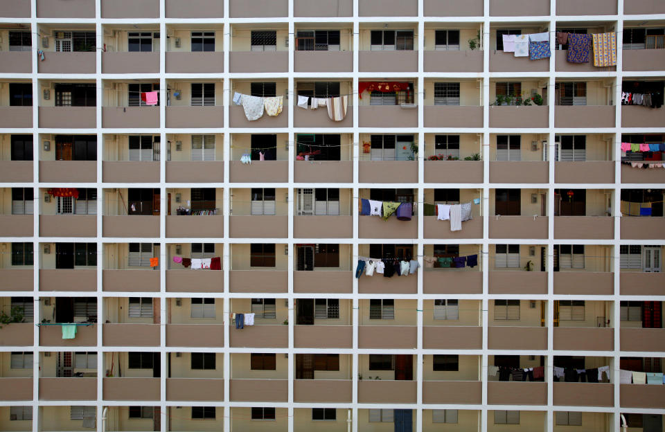 Clothes are hung for drying outside public housing estate flats built by the Housing and Development Board. (Photo: REUTERS/Nicky Loh)