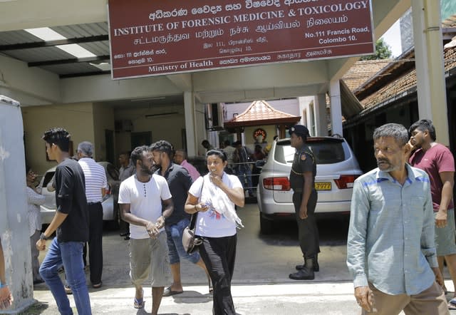 Relatives gather outside a hospital in Colombo