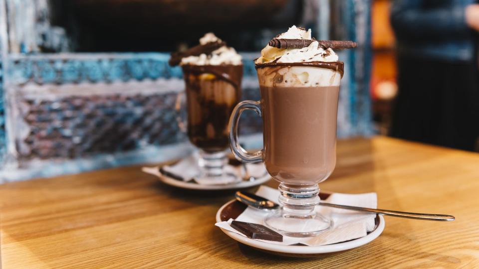 two decadent hot chocolates served in a trendy cafe