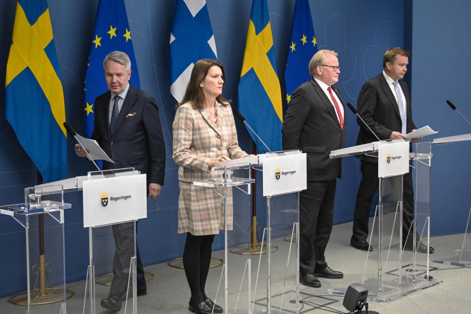 From left, Finland's Minister for Foreign Affairs Pekka Haavisto, his Swedish counterpart Ann Linde, Sweden's Defence Minister Peter Hultqvist, and his Finnish counterpart Antti Kaikkonen hold a joint press conference in Stockholm, Sweden, Wednesday, Feb. 2, 2022, after talks on European security. (Anders Wiklund, TT News Agency via AP)