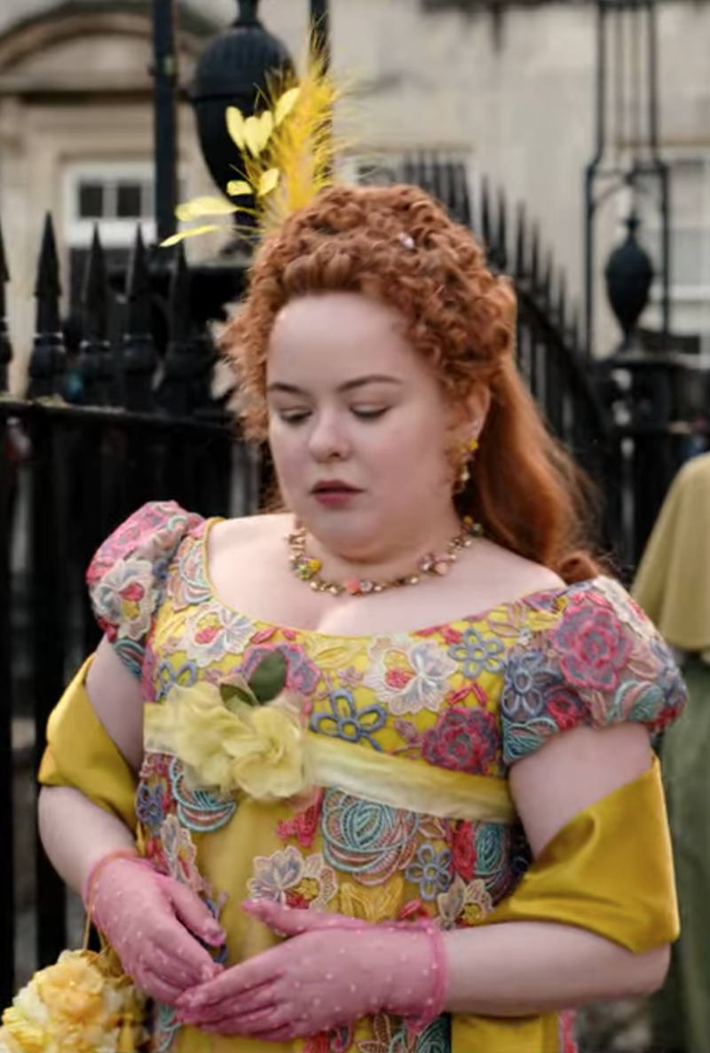 <p> Ever the maximalist, Penelope wore this eccentric outfit for an afternoon stroll. Please note the mustard silk shawl, feather headpiece, and pink polka dot sheer gloves. </p>
