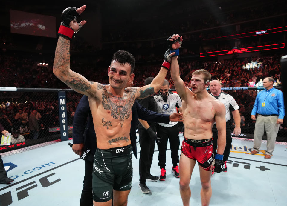 KANSAS CITY, MISSOURI - APRIL 15: (L-R) Max Holloway reacts after defeating Arnold Allen of England in a featherweight fight during the UFC Fight Night event at T-Mobile Center on April 15, 2023 in Kansas City, Missouri. (Photo by Josh Hedges/Zuffa LLC via Getty Images)