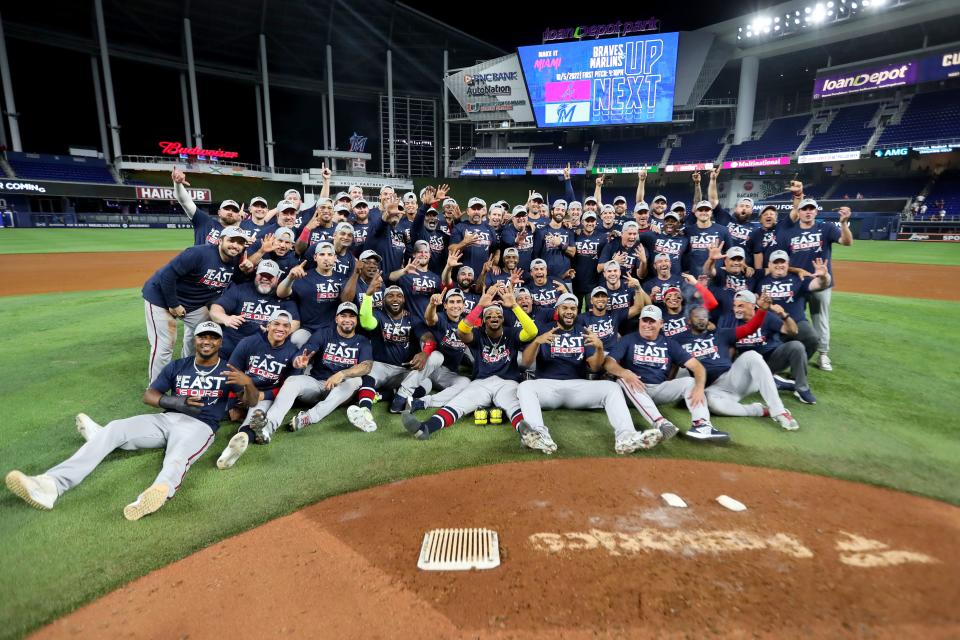 MIAMI, FLORIDA - OCTOBER 04: The Atlanta Braves pose for a group picture after clinching the division against the Miami Marlins at loanDepot park on October 04, 2022 in Miami, Florida. (Photo by Megan Briggs/Getty Images)