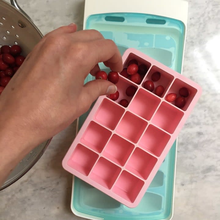 THE IDEA: It's super straightforward! Fresh cranberries + ice cube tray + water = cute ice cubes. Just make sure to rinse your cranberries first.