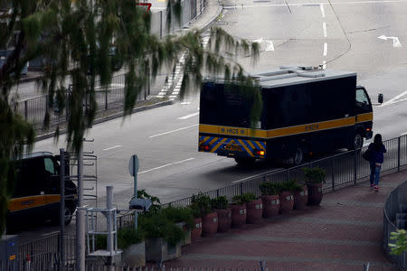 A prison van (R) carrying British former banker Rurik Jutting, on a double murder trial, leaves Lai Chi Kok Reception Centre to the High Court in Hong Kong, China November 3, 2016. REUTERS/Bobby Yip