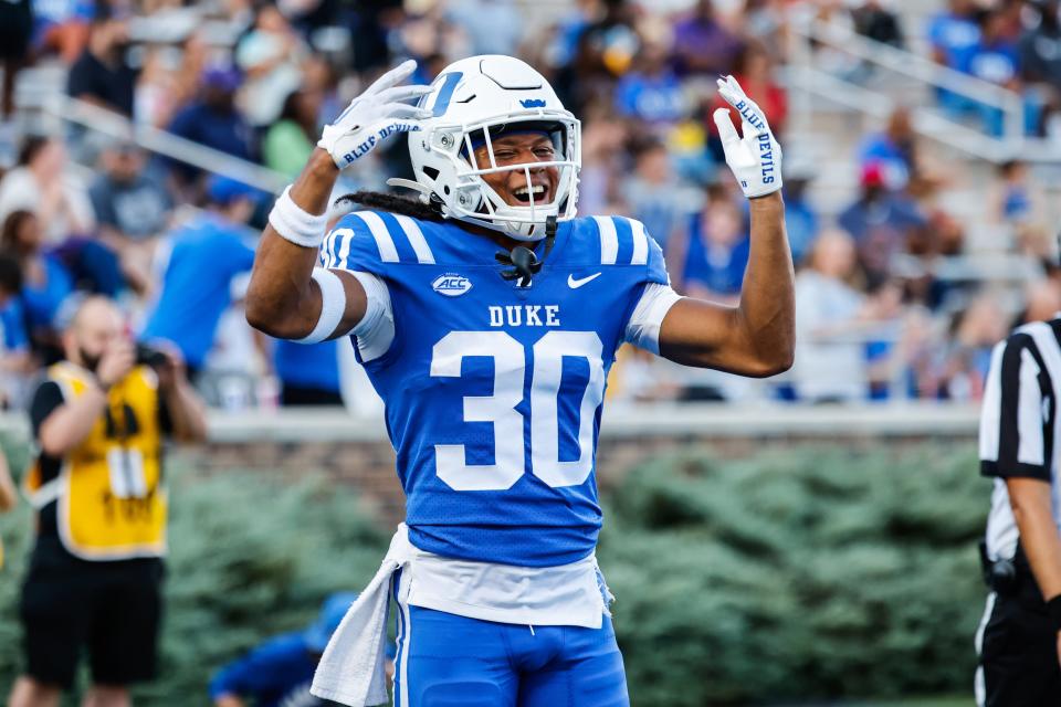 Sep 17, 2022; Durham, North Carolina, USA; Duke Blue Devils defensive back Brandon Johnson (30) celebrates a touchdown during first half against North Carolina A&T Aggies at Wallace Wade Stadium. Mandatory Credit: Jaylynn Nash-USA TODAY Sports