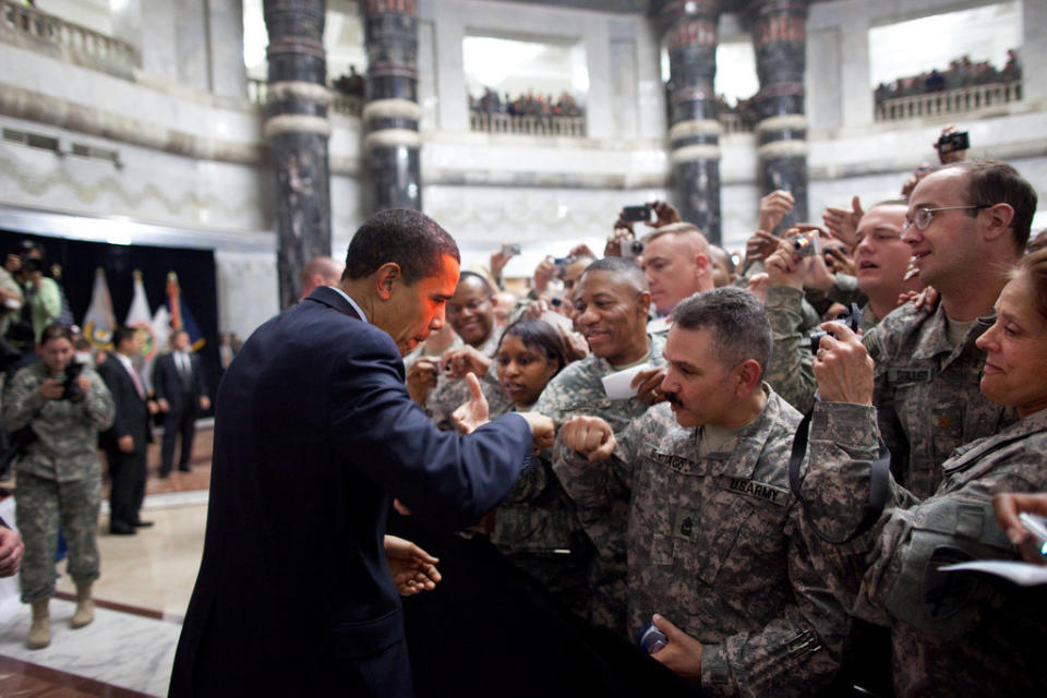 Obama receives a fist-bump from a U.S. soldier as he greets hundreds of U.S. troops during his visit to Camp Victory, Iraq, on April 7, 2009.