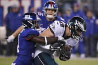 Philadelphia Eagles tight end Dallas Goedert (88) is stopped after a catch by New York Giants defensive back Michael Thomas (31) NFL football game, Sunday, Dec. 29, 2019, in East Rutherford, N.J. (AP Photo/Seth Wenig)