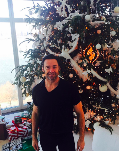 <p>Hugh Jackman struck a pose in front of his enormous Christmas tree and posted a special holiday greeting: “Merry Christmas to you and yours …” (Photo: <a rel="nofollow noopener" href="https://www.instagram.com/p/BOcqv4WjJGl/" target="_blank" data-ylk="slk:Instagram;elm:context_link;itc:0" class="link ">Instagram</a>) </p>