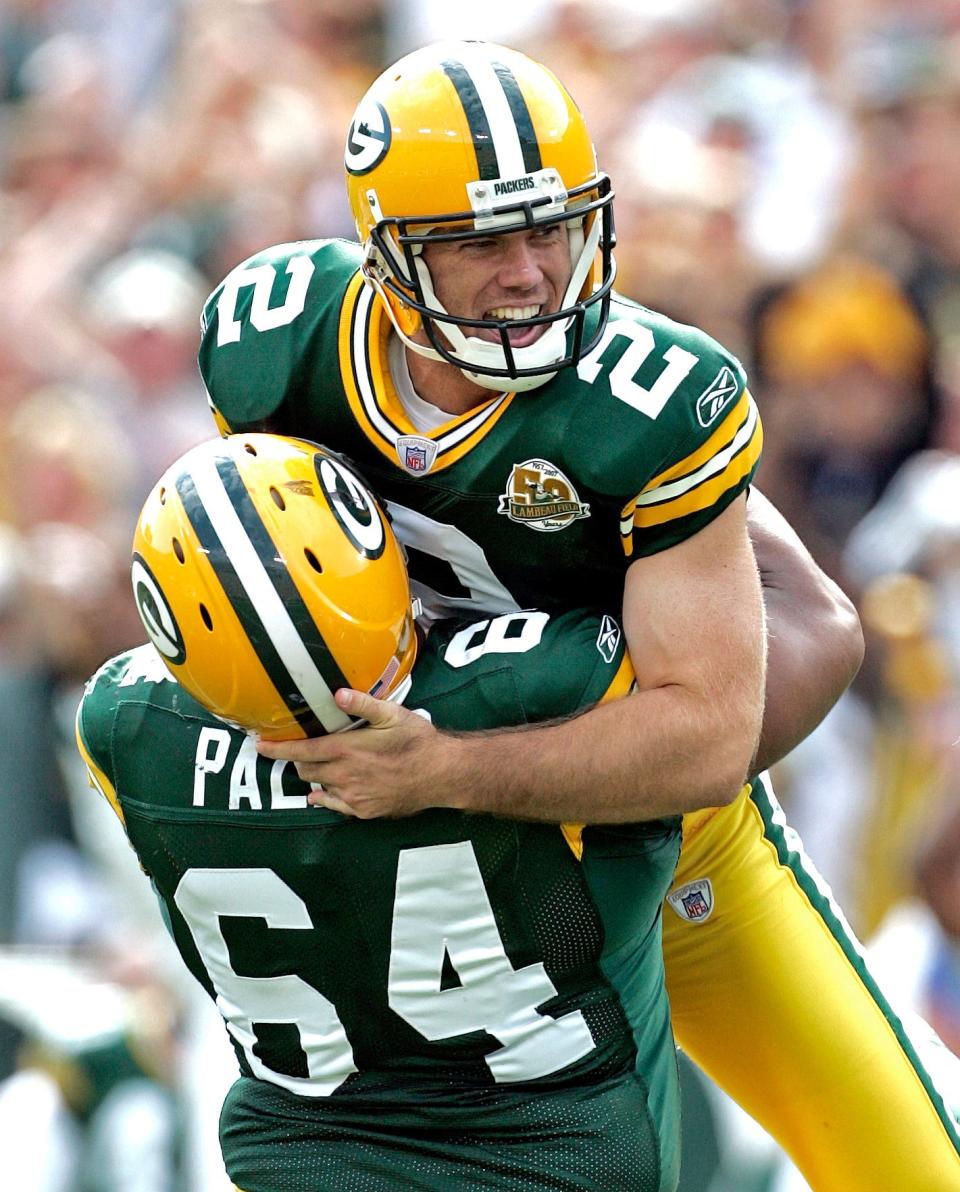 Mason Crosby and Tony Palmer celebrate Crosby's game winning field goal with seconds left in the fourth quarter on Sept. 9, 2007.