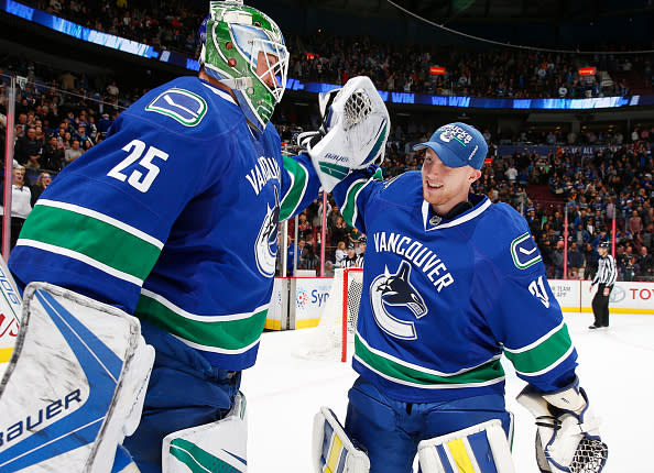 VANCOUVER, BC - OCTOBER 18: Matt Hewitt #31 of the Vancouver Canucks congratulates winning goaltender Jacob Markstrom #25 after defeating the St. Louis Blues in their NHL game at Rogers Arena October 18, 2016 in Vancouver, British Columbia, Canada. Vancouver won 2-1 in overtime. (Photo by Jeff Vinnick/NHLI via Getty Images)