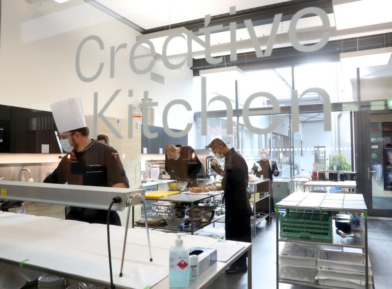 Cooks work in a kitchen at the Nestle Research Center in Konolfingen