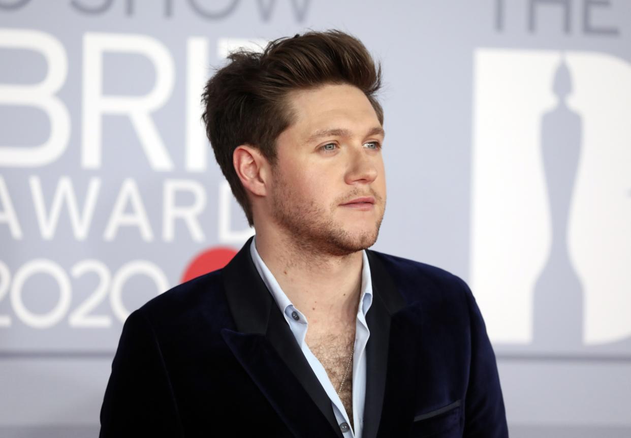 Niall Horan poses for photographers upon arrival at Brit Awards 2020 in London, Tuesday, Feb. 18, 2020.(Photo by Vianney Le Caer/Invision/AP)