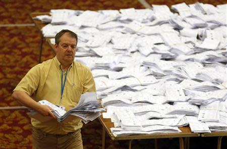 European Parliamentary election ballot papers, from the local area, are sorted as part of the count, in Southampton, southern England May 25, 2014. REUTERS/Luke MacGregor