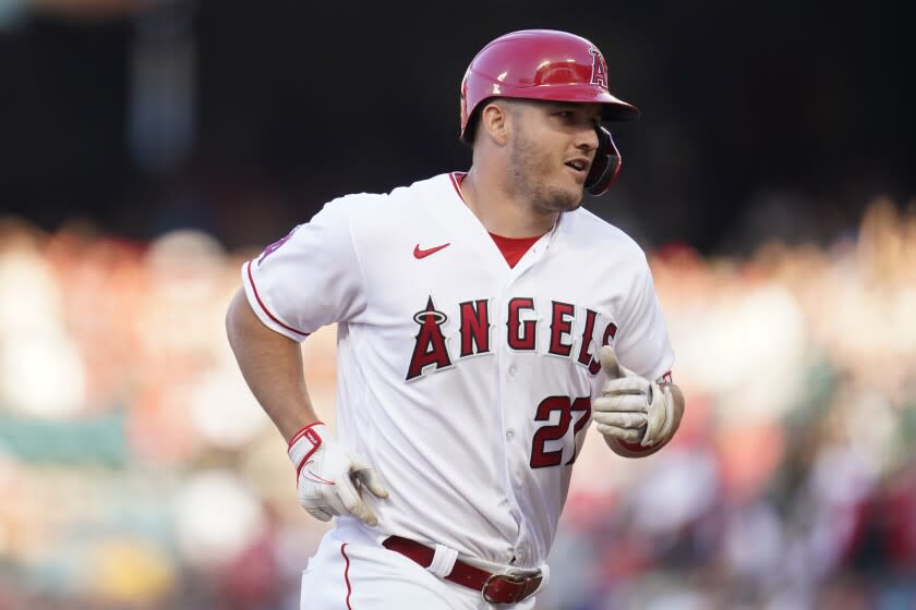 Los Angeles Angels center fielder Mike Trout (27) runs the bases after hitting a home run.
