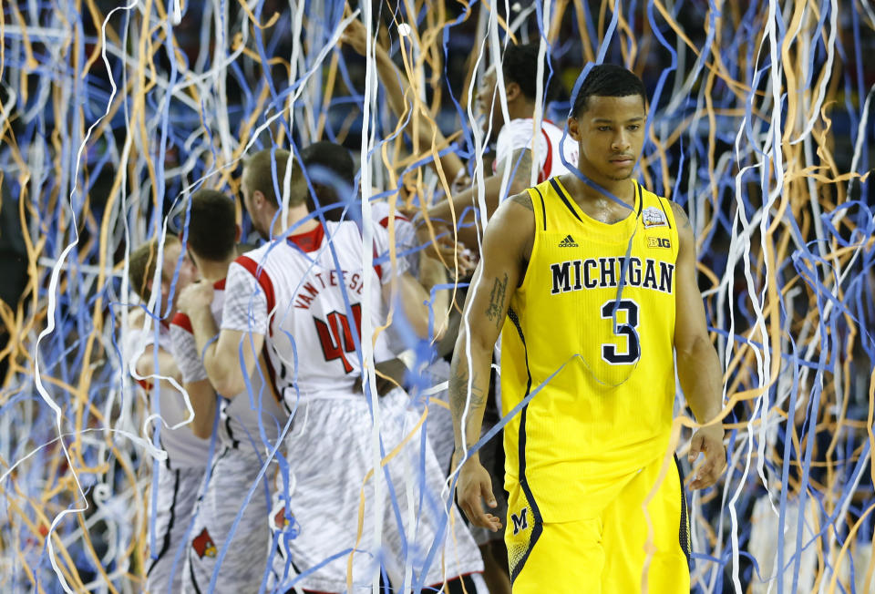 The Louisville Cardinals celebrate their victory over the the Michigan Wolverines in the 2013 NCAA championship basketball game. (Photo: Jeff Haynes / Reuters)