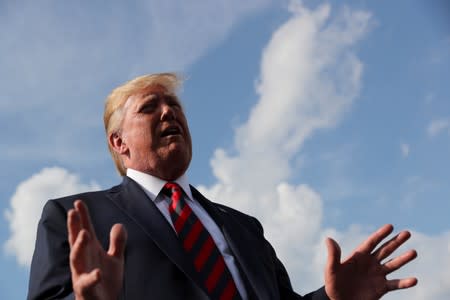 U.S. President Donald Trump speaks to reporters before boarding Air Force One to return to Washington from Morristown Municipal Airport in Morristown, New Jersey