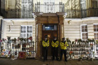 Police officers patrol outside the Myanmar Embassy in London, Wednesday, April 7, 2021. Newspaper reports say the embassy was taken over by members of the country's new military regime Wednesday evening. (AP Photo/Alberto Pezzali)