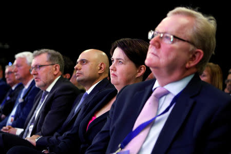 Ruth Davidson, leader of Scottish Conservatives, listens to Britain's Prime Minister Theresa May at the Scottish Conservative conference in Aberdeen, Scotland, Britain May 3, 2019. REUTERS/Russell Cheyne