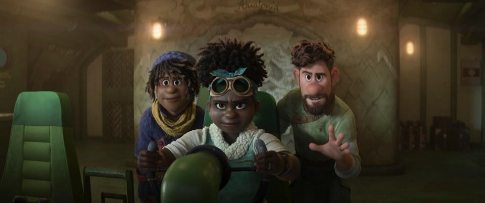 Ethan (voiced by Jaboukie Young-White, left), his mom Meridian (Gabrielle Union) and dad Searcher (Jake Gyllenhaal) venture into uncharted territory in "Strange World."