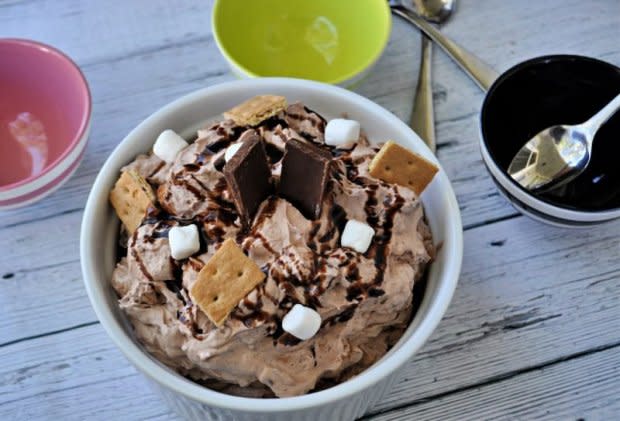 <p>Krista Marshall</p><p>Bring the campfire fun inside any afternoon of the week with this chocolatey goodness.</p><p><strong>Get the recipe: <a href="https://parade.com/1095930/kristamarshall/easy-smores-fluff-dessert-recipe/" rel="nofollow noopener" target="_blank" data-ylk="slk:S'mores Fluff;elm:context_link;itc:0;sec:content-canvas" class="link ">S'mores Fluff</a></strong></p>