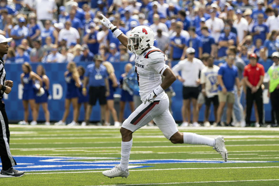 Ball State defensive back Tyler Potts (4) celebrates after intercepting the ball during the first half of an NCAA college football game against Kentucky in Lexington, Ky., Saturday, Sept. 2, 2023. (AP Photo/Michelle Haas Hutchins)