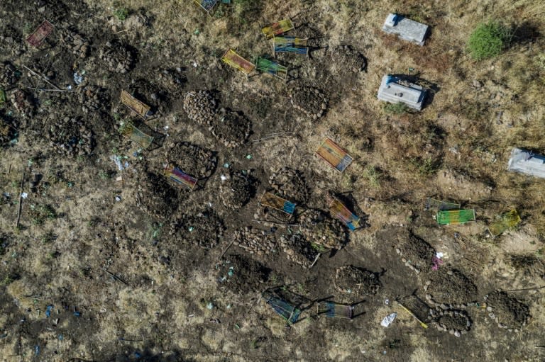 This aerial view taken on November 21 shows a cemetery where alleged victims of the November 9 massacre were buried in collective graves in Mai-Kadra
