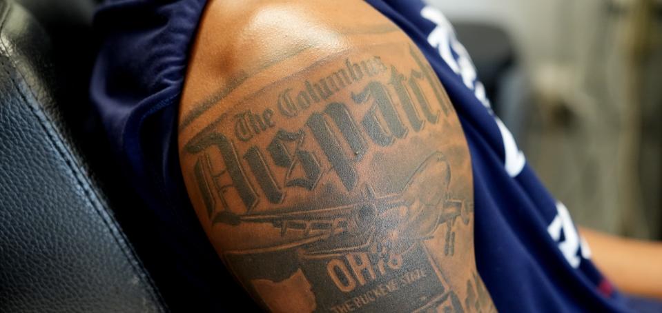 Farleigh Dickinson forward Sean Moore's right arm tattoos feature the Columbus Dispatch nameplate.