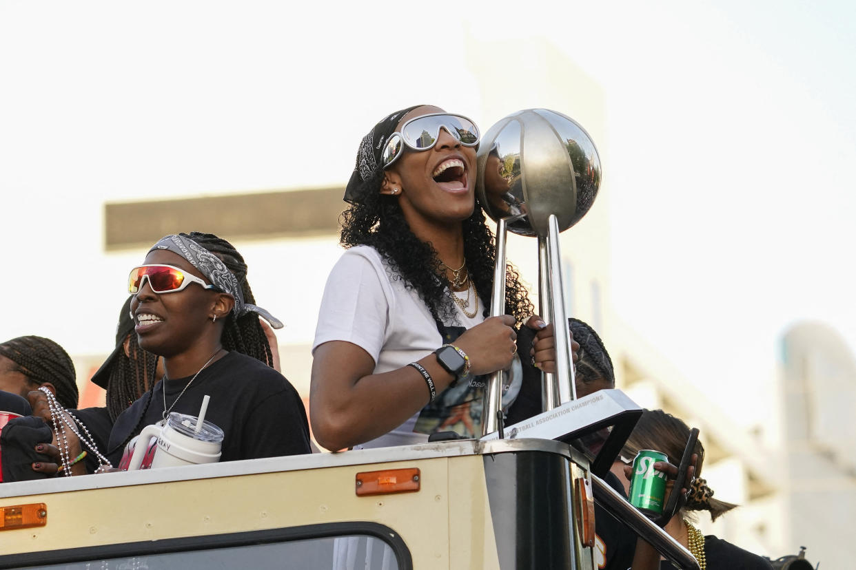 A'ja Wilson was the keeper of the trophy during the Aces' championship parade. (Lucas Peltier/Reuters)